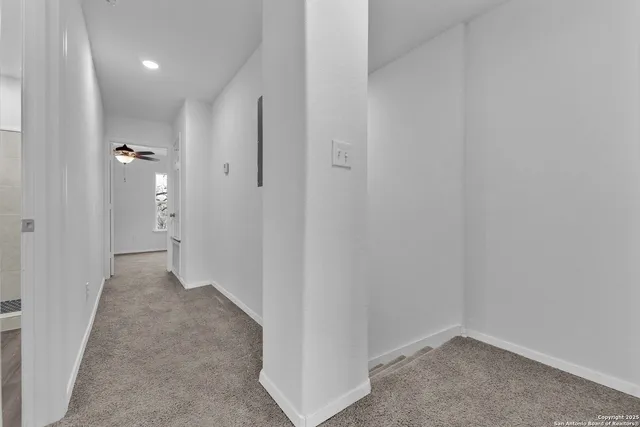 a view of a hallway with closet