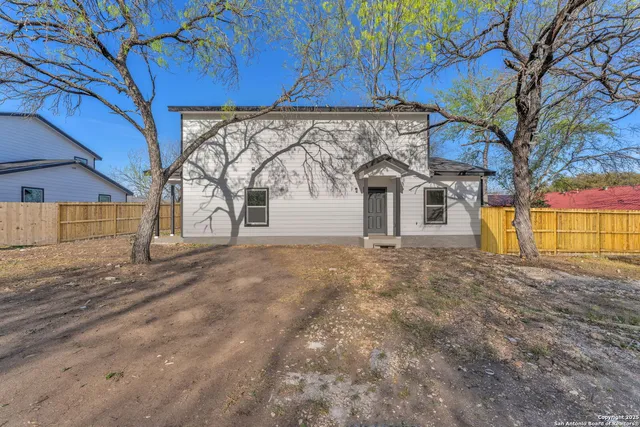 a view of a house with a snow in the yard