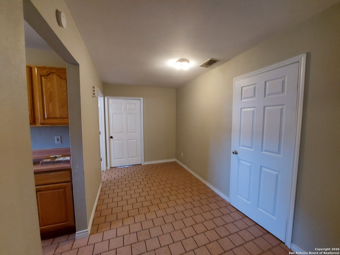 9510 Cross Rdg Lane San Antonio, TX 78263 - Photo 15 of 30 a view of an empty room with kitchen and window