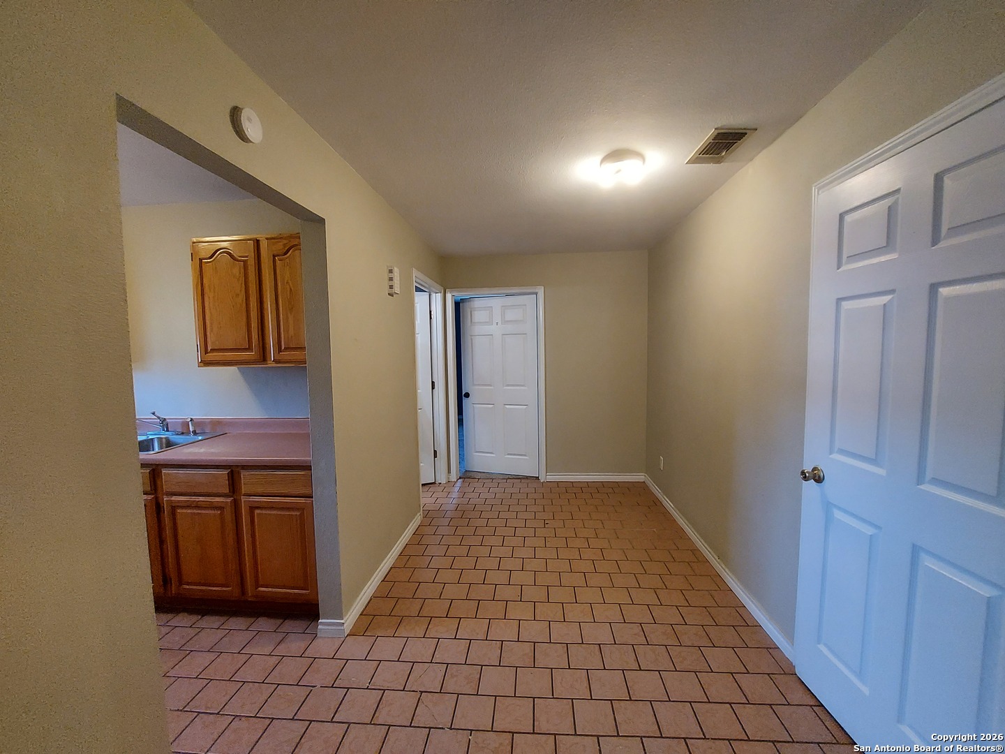9510 Cross Rdg Lane San Antonio, TX 78263 - Photo 16 of 30 a view of a hallway to rooms and stairs