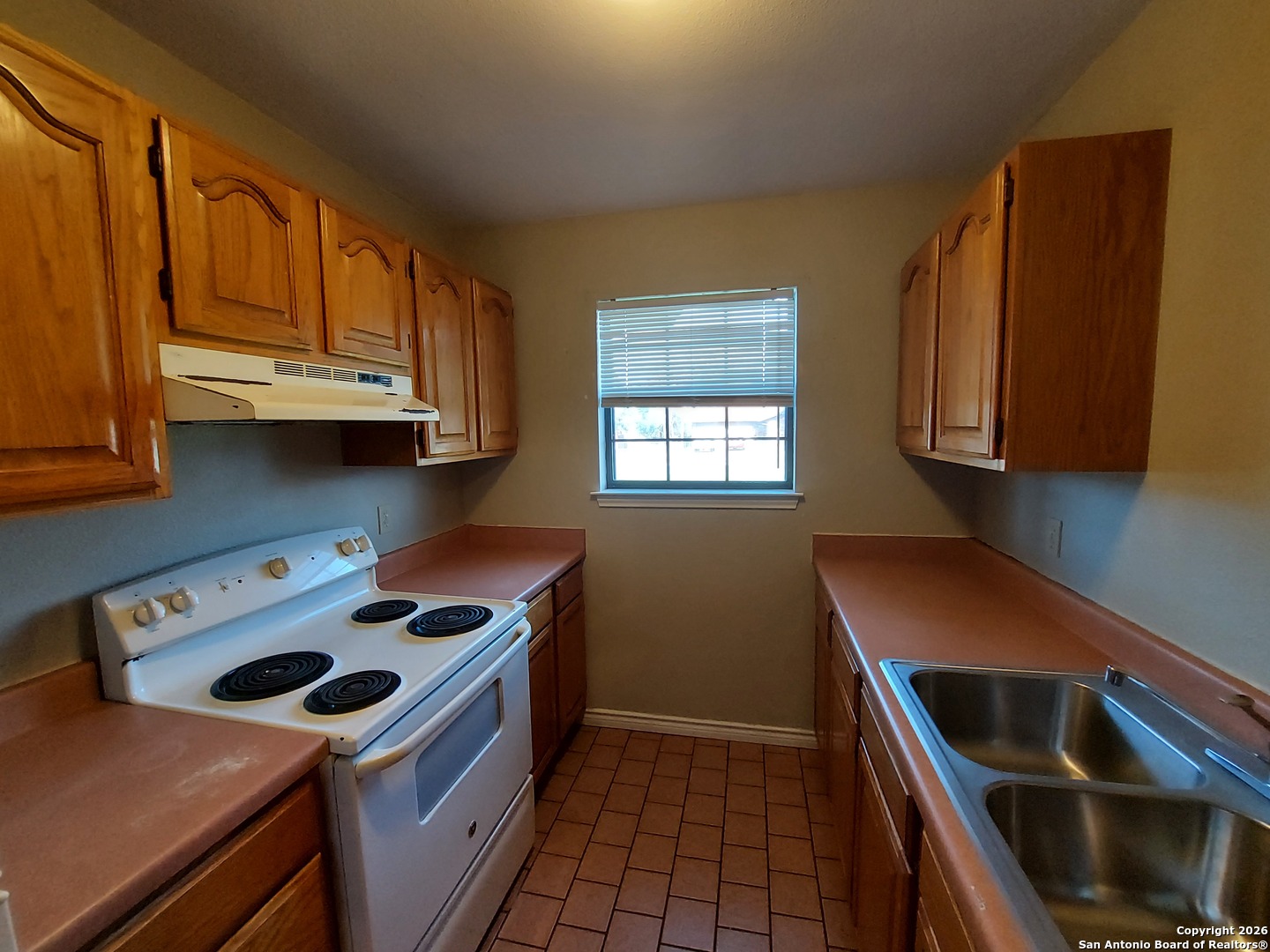 9510 Cross Rdg Lane San Antonio, TX 78263 - Photo 20 of 30 a kitchen with stainless steel appliances a stove a sink and a microwave
