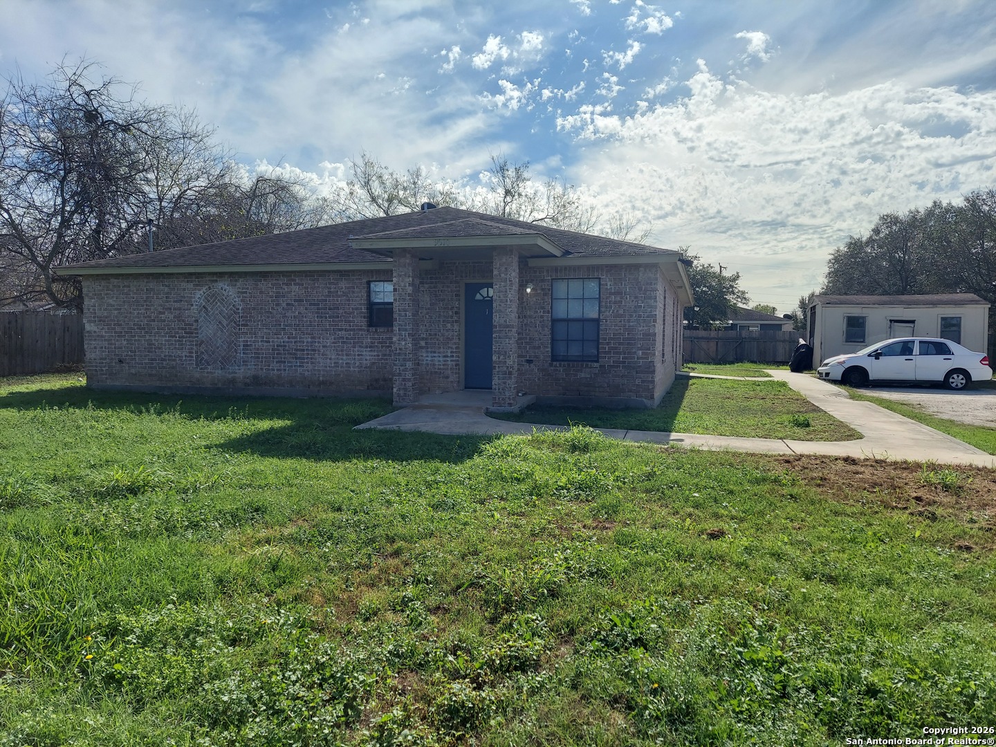 9510 Cross Rdg Lane San Antonio, TX 78263 - Photo 2 of 30 a view of a backyard with barn plants and large tree