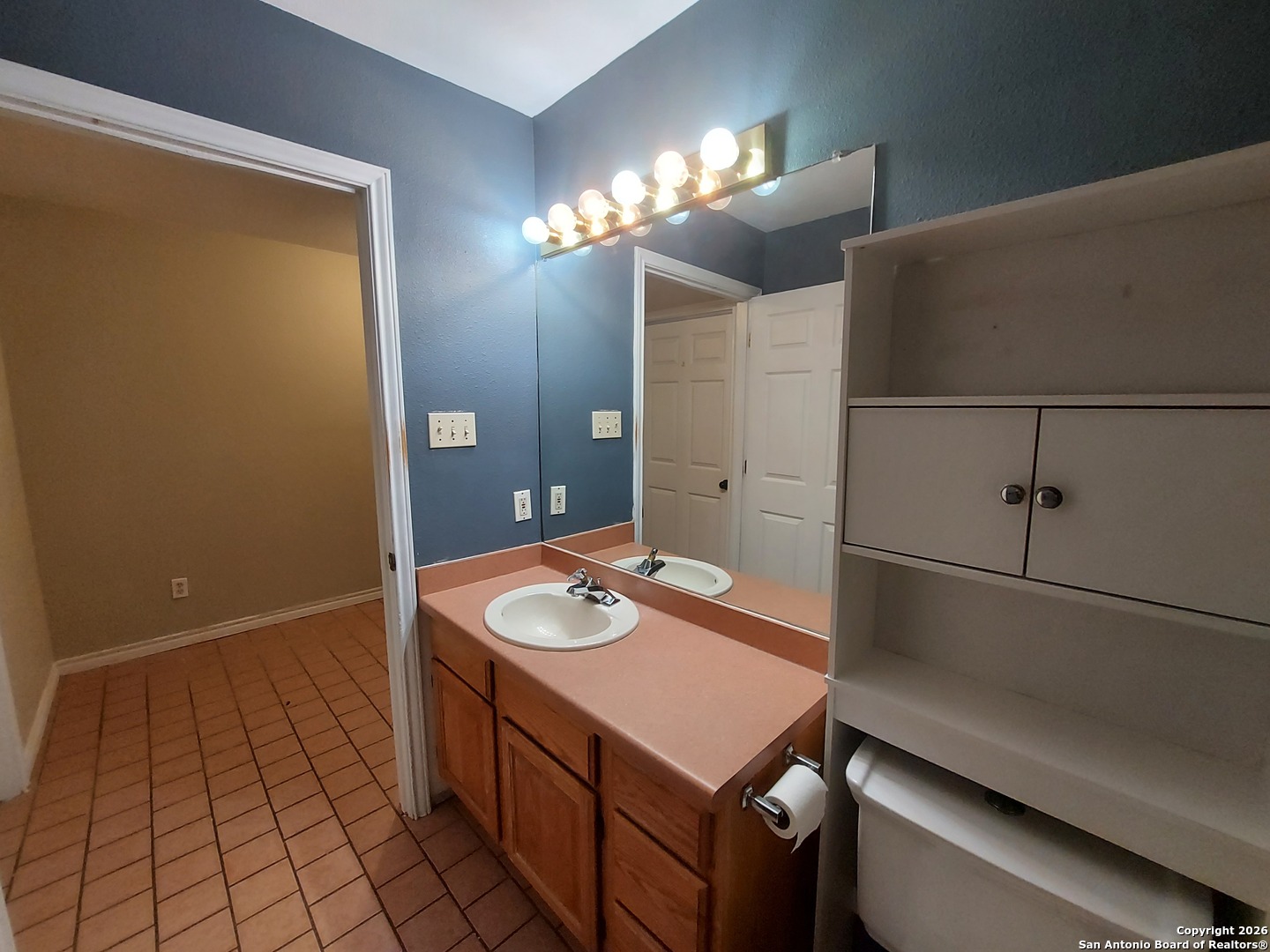 9510 Cross Rdg Lane San Antonio, TX 78263 - Photo 26 of 30 a bathroom with a sink a toilet a mirror and shower