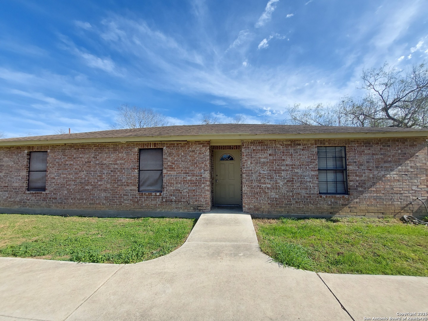 9510 Cross Rdg Lane San Antonio, TX 78263 - Photo 28 of 30 a view of a brick house with a yard