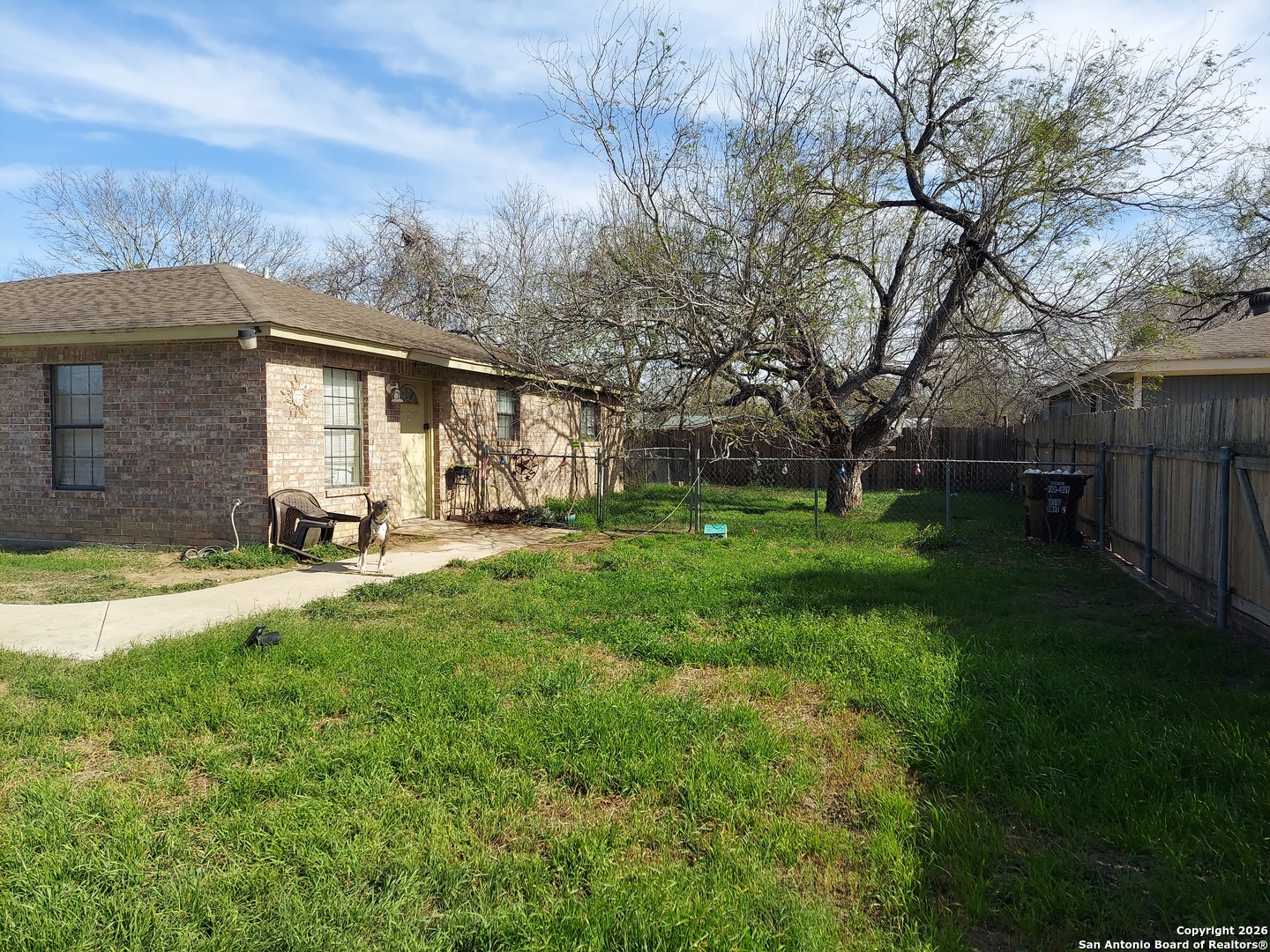 9510 Cross Rdg Lane San Antonio, TX 78263 - Photo 30 of 30 a view of a house with backyard and a tree