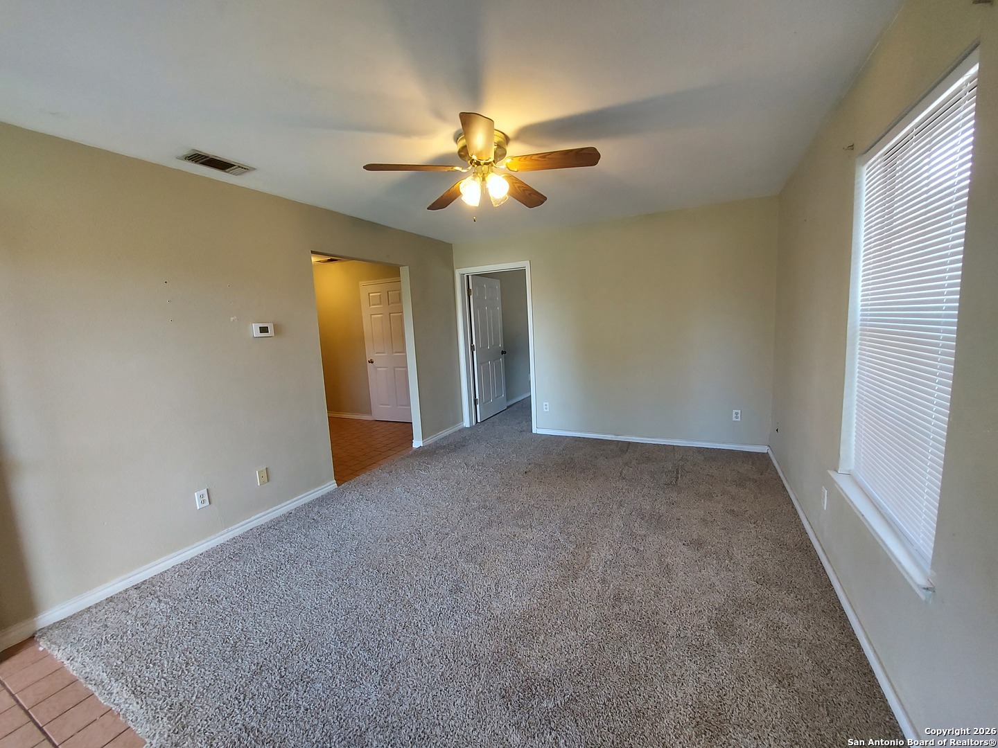 9510 Cross Rdg Lane San Antonio, TX 78263 - Photo 5 of 30 a view of a livingroom with a ceiling fan and window