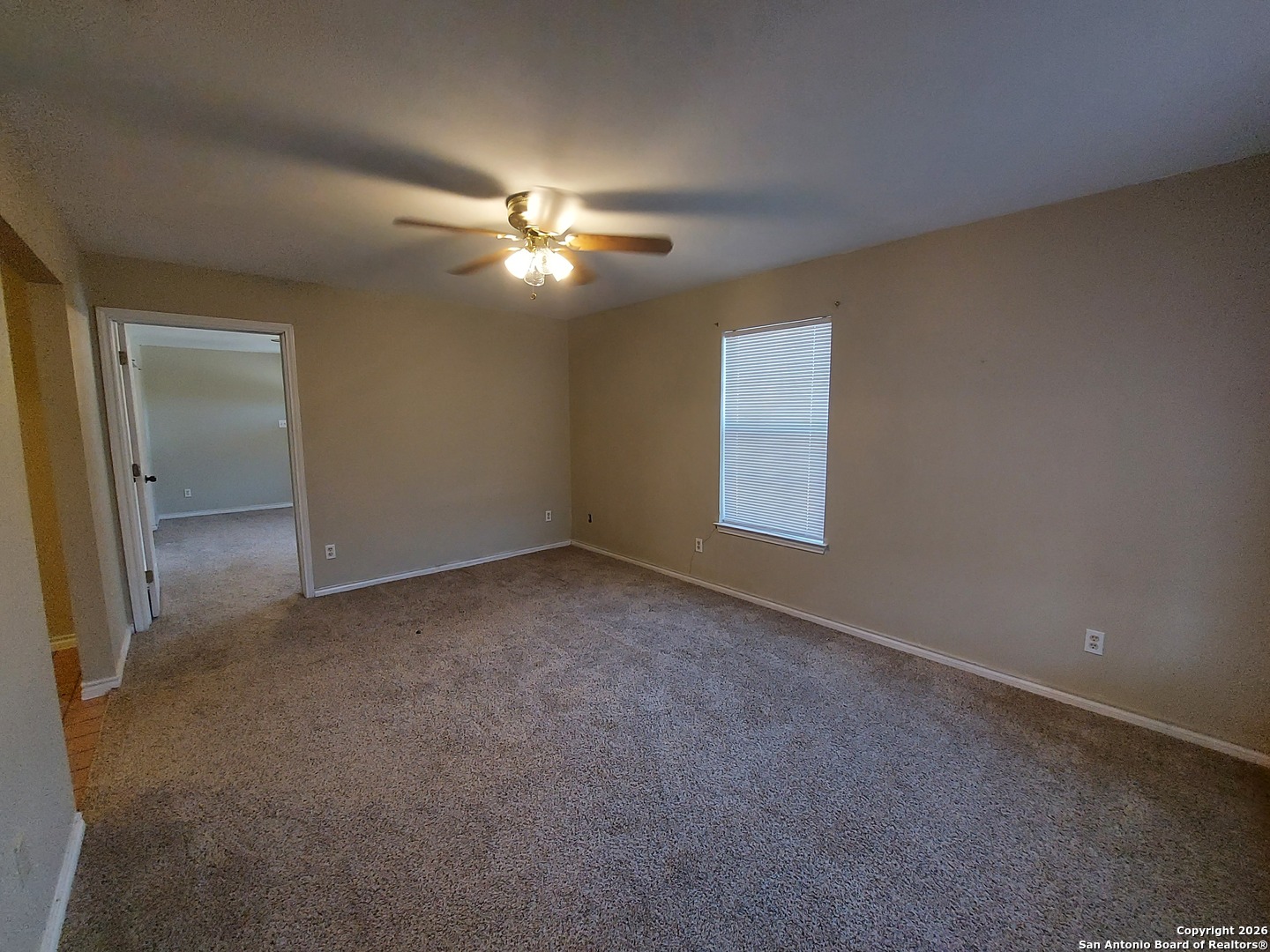 9510 Cross Rdg Lane San Antonio, TX 78263 - Photo 7 of 30 an empty room with windows and fan