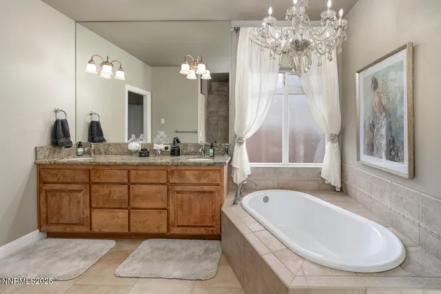 a bathroom with a tub sink and mirror