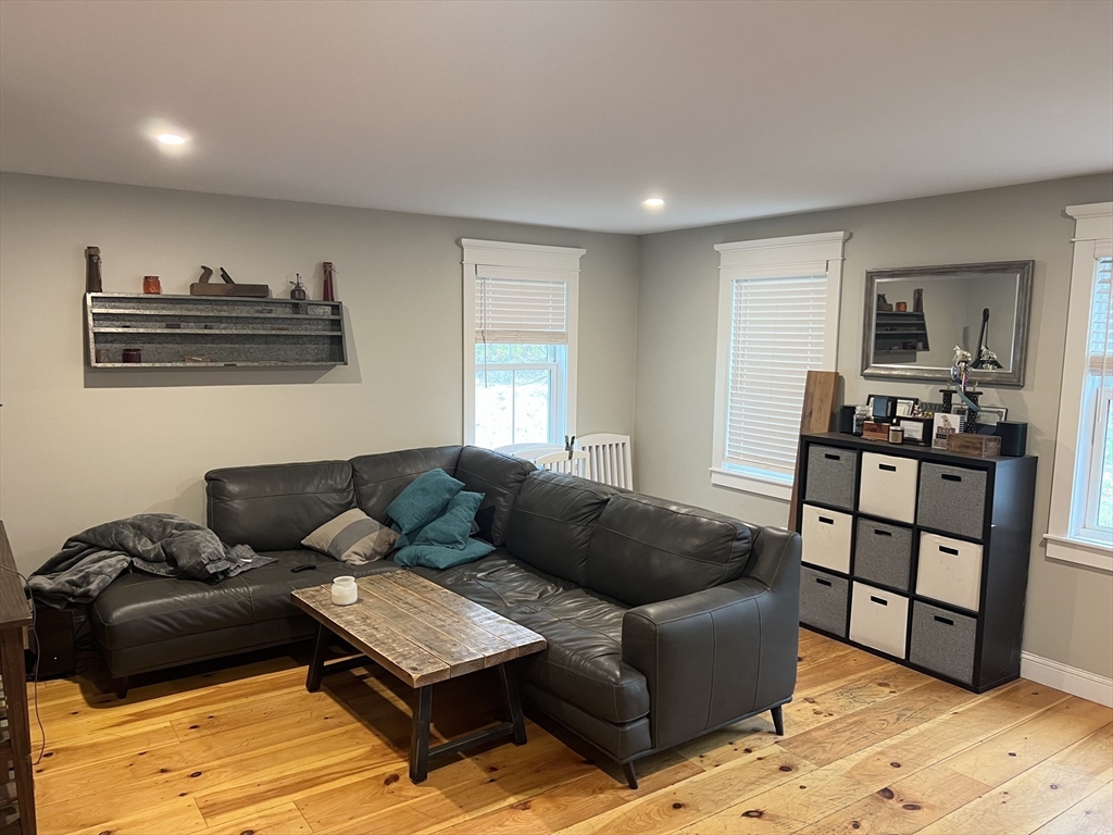 879 Long Pond Road Plymouth, MA 02360 - Photo 11 of 39 a living room with furniture and wooden floor