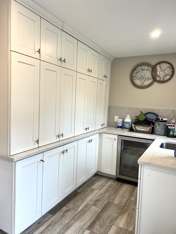 879 Long Pond Road Plymouth, MA 02360 - Photo 12 of 39 a kitchen with granite countertop white cabinets and white appliances