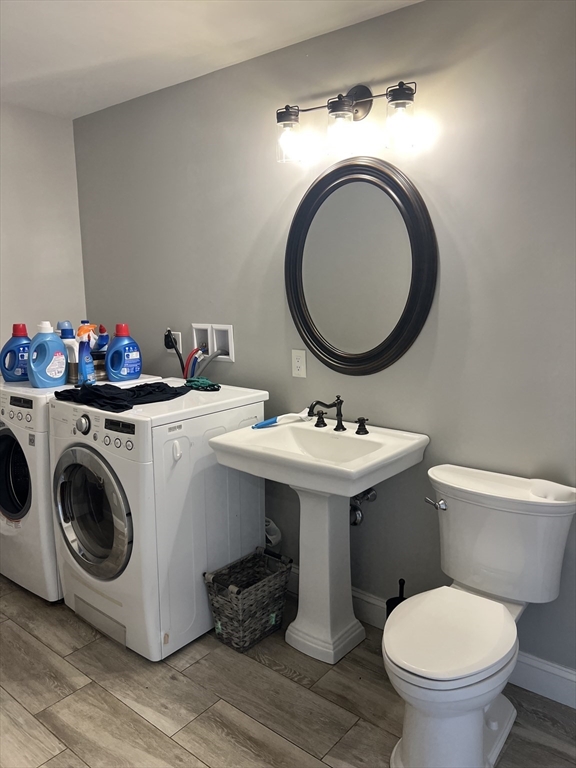 879 Long Pond Road Plymouth, MA 02360 - Photo 15 of 39 a bathroom with a sink mirror and toilet