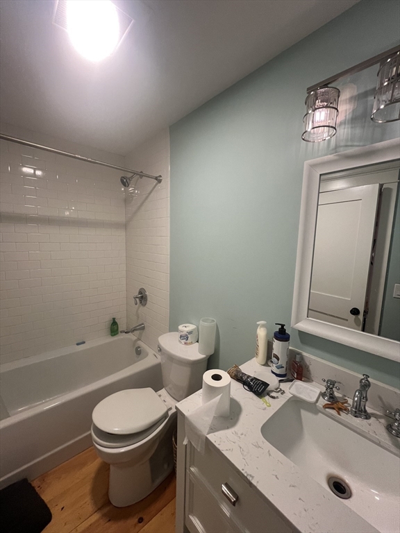 879 Long Pond Road Plymouth, MA 02360 - Photo 20 of 39 a bathroom with a toilet a sink a tub and mirror