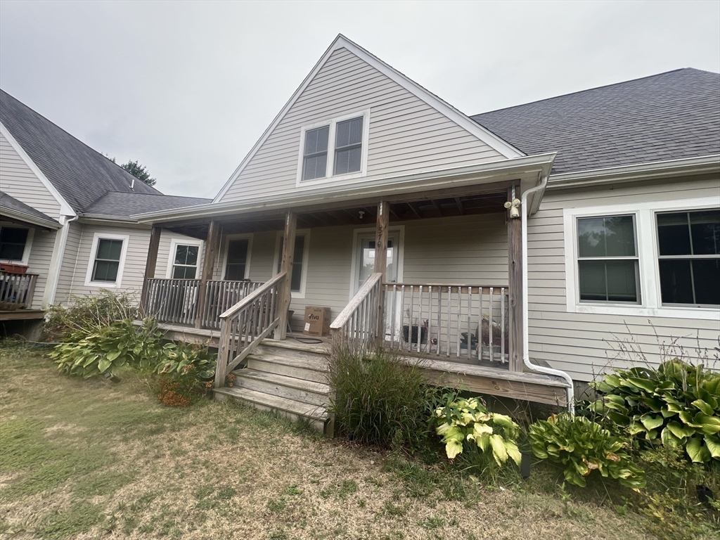 879 Long Pond Road Plymouth, MA 02360 - Photo 22 of 39 a front view of a house with a yard