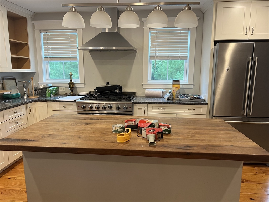 879 Long Pond Road Plymouth, MA 02360 - Photo 25 of 39 a kitchen with stainless steel appliances granite countertop a sink stove and refrigerator