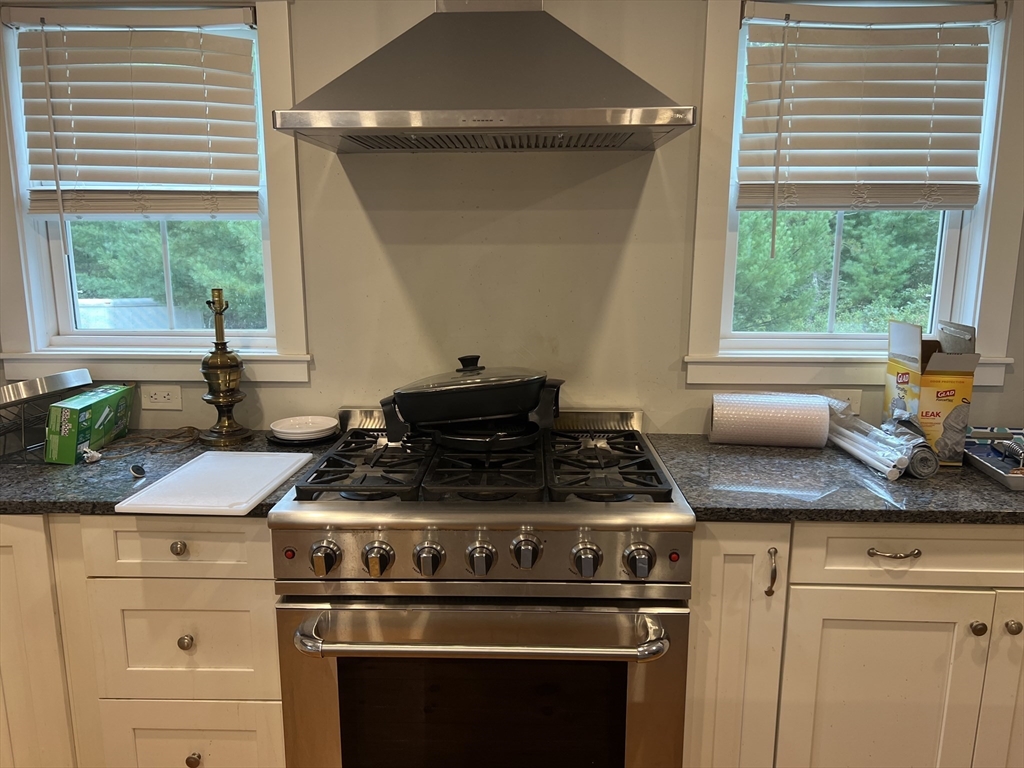 879 Long Pond Road Plymouth, MA 02360 - Photo 26 of 39 a stove top oven sitting inside of a kitchen