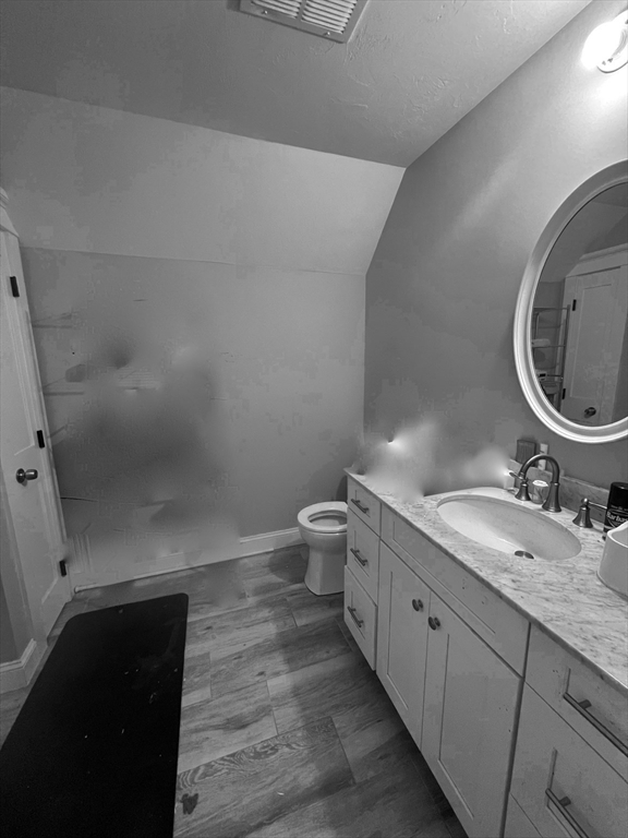 879 Long Pond Road Plymouth, MA 02360 - Photo 32 of 39 a bathroom with a granite countertop sink a toilet and a mirror