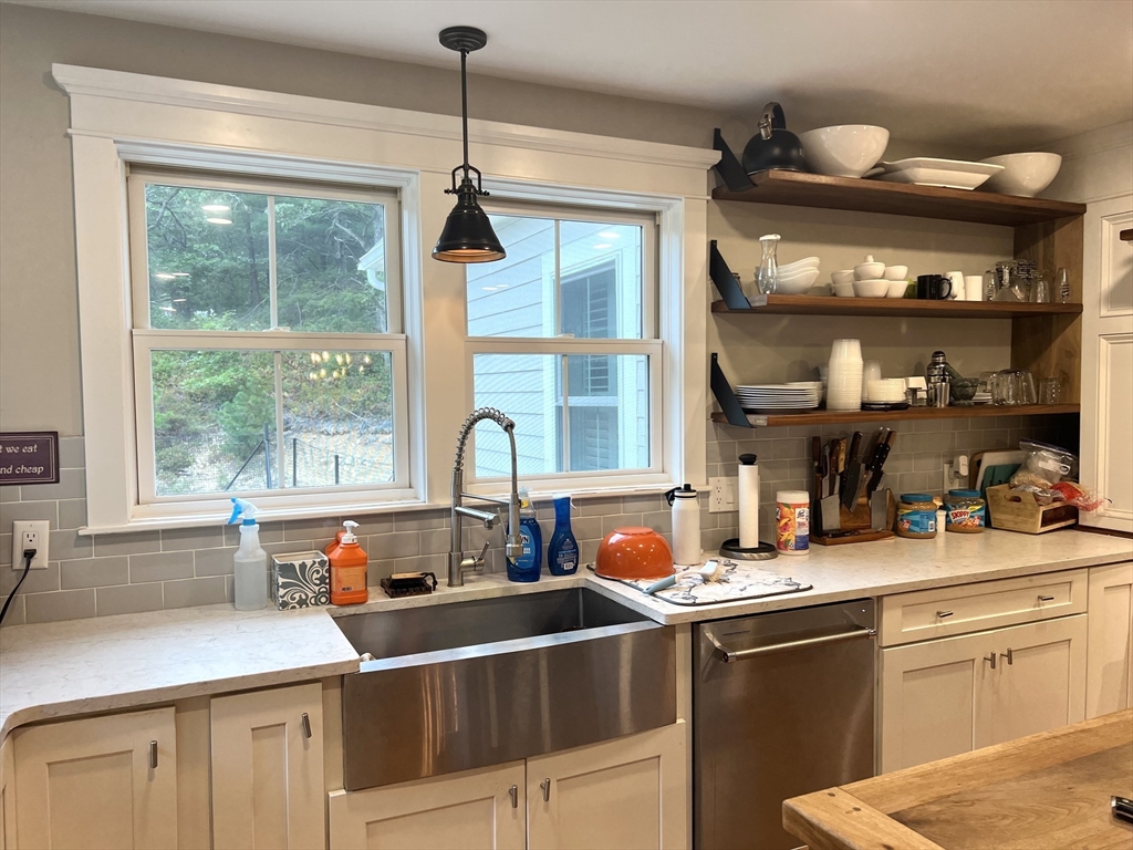 879 Long Pond Road Plymouth, MA 02360 - Photo 9 of 39 a kitchen with a sink stove and cabinets