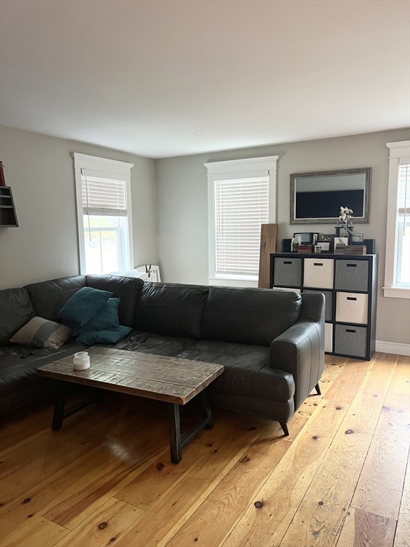 879 Long Pond Road Plymouth, MA 02360 - Photo 10 of 39 a living room with furniture and a flat screen tv