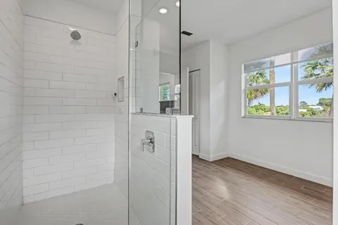a bathroom with a shower and a sink