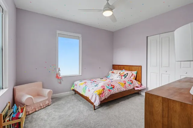a front view of a house with a yard table and chairs
