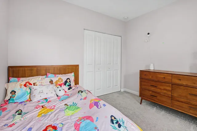 an aerial view of residential houses with outdoor space and river