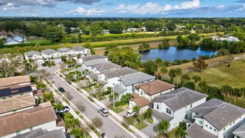 an aerial view of residential houses with outdoor space