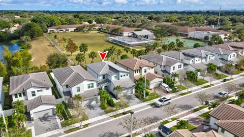 an aerial view of residential houses with outdoor space