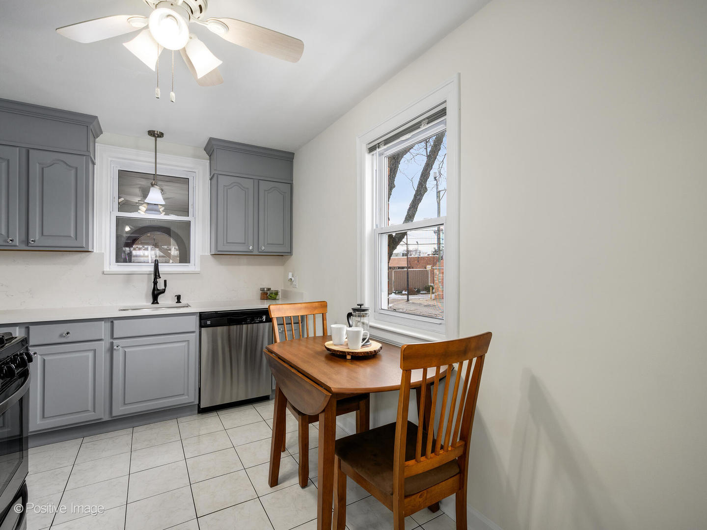 6057 West Melrose Street Chicago, IL 60634 - Photo 12 of 32 a view of a kitchen area with furniture and window