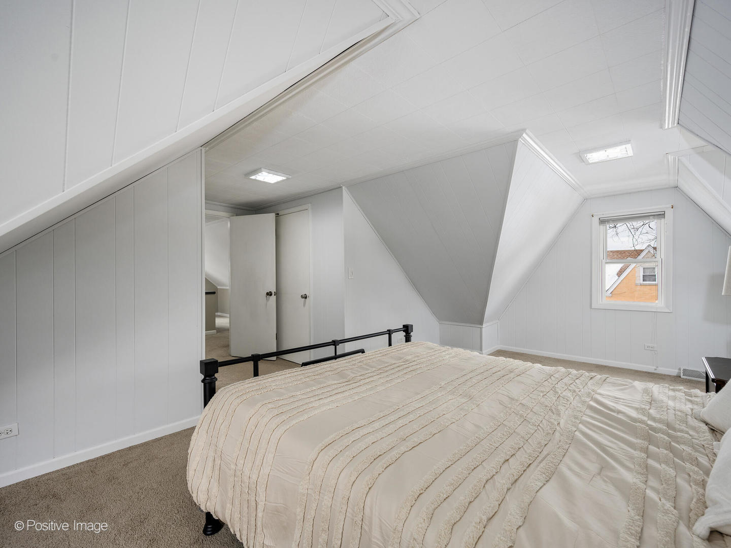 6057 West Melrose Street Chicago, IL 60634 - Photo 19 of 32 a bedroom with a bed and a window