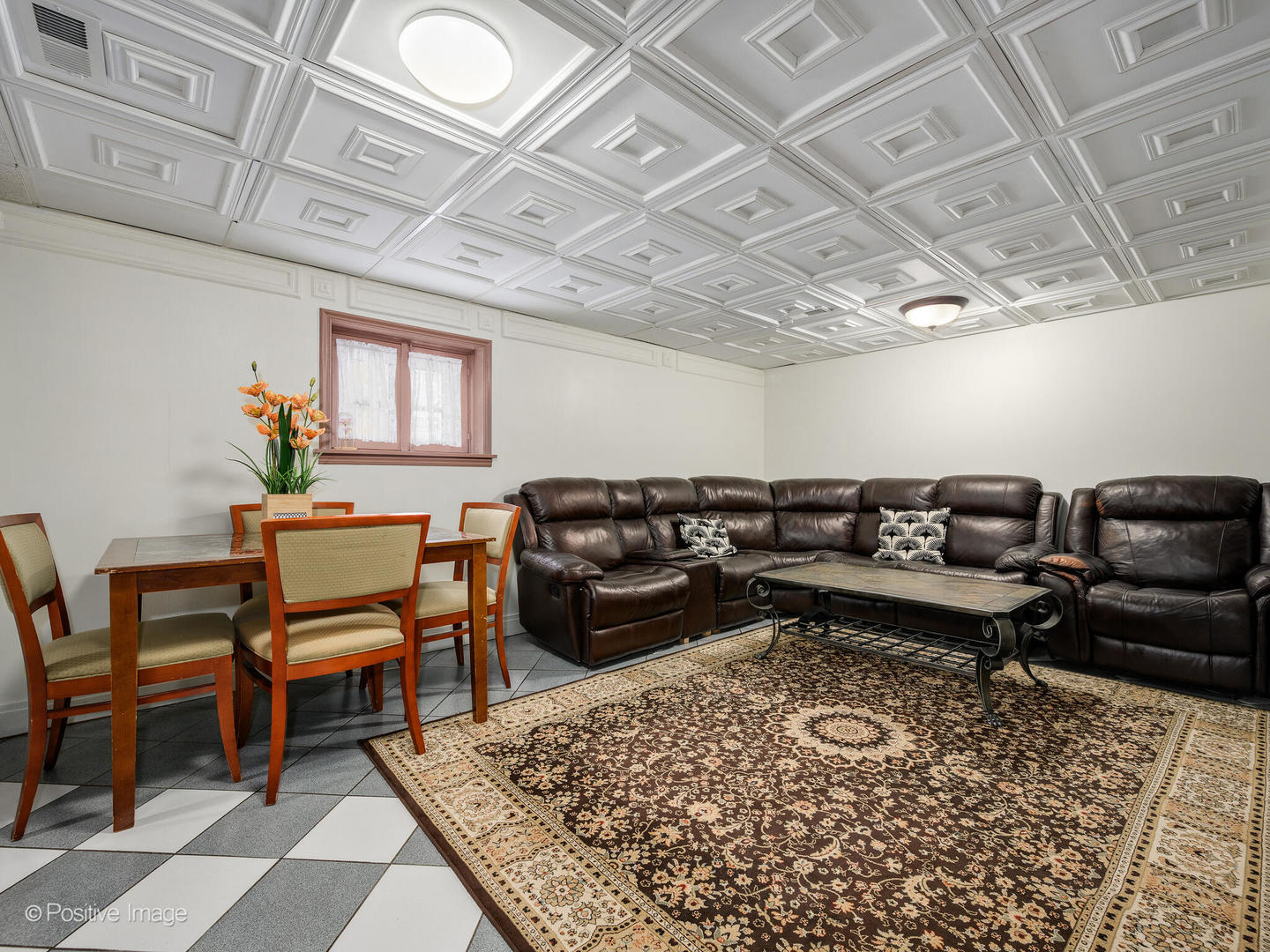 6057 West Melrose Street Chicago, IL 60634 - Photo 22 of 32 a living room with a couch and a rug