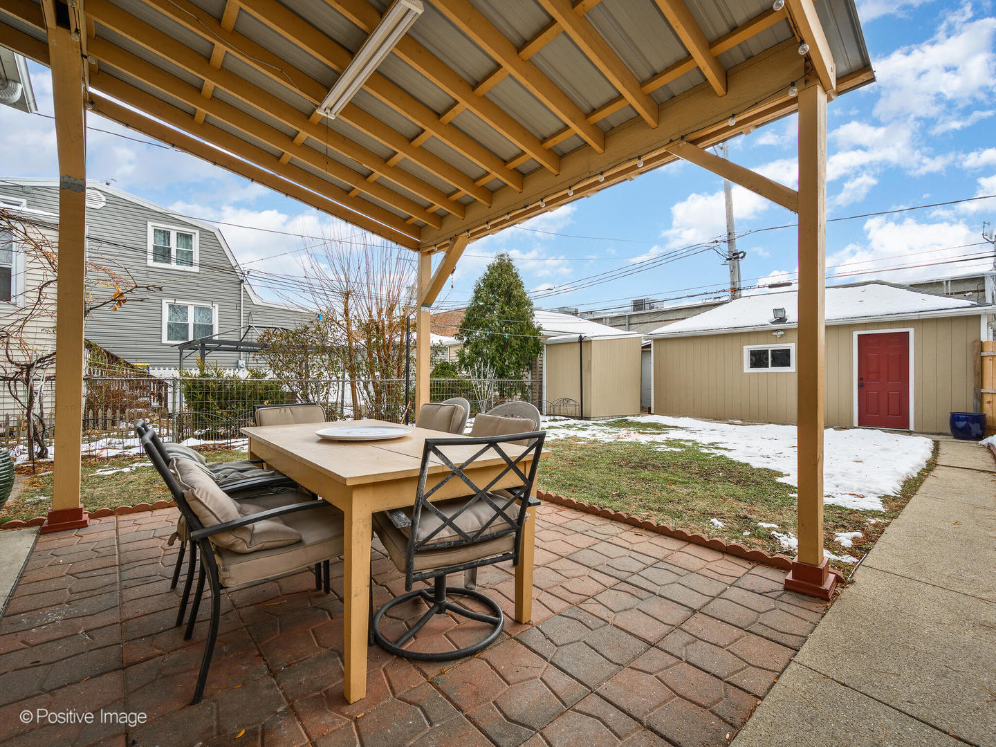 6057 West Melrose Street Chicago, IL 60634 - Photo 30 of 32 a view of a patio with table and chairs and potted plants