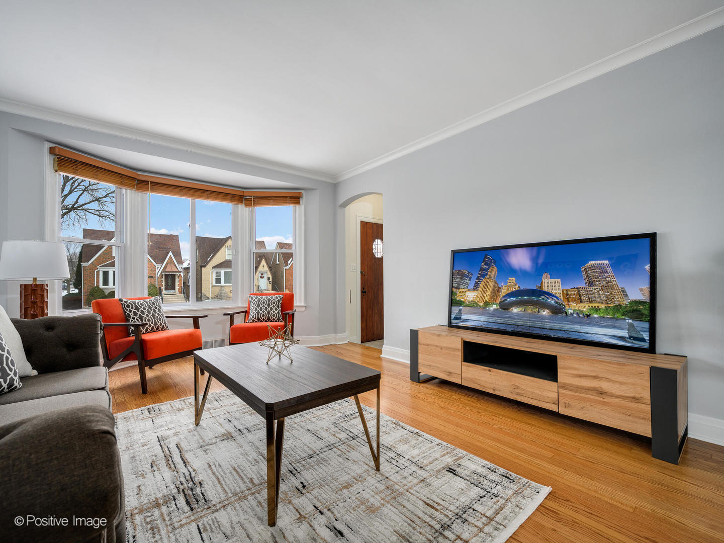 6057 West Melrose Street Chicago, IL 60634 - Photo 3 of 32 a living room with furniture a rug and a large window