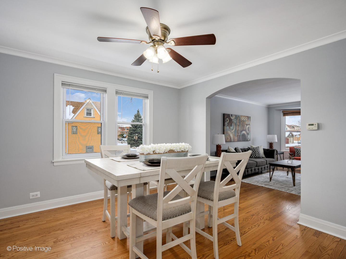 6057 West Melrose Street Chicago, IL 60634 - Photo 8 of 32 a view of a dining room with furniture window and wooden floor