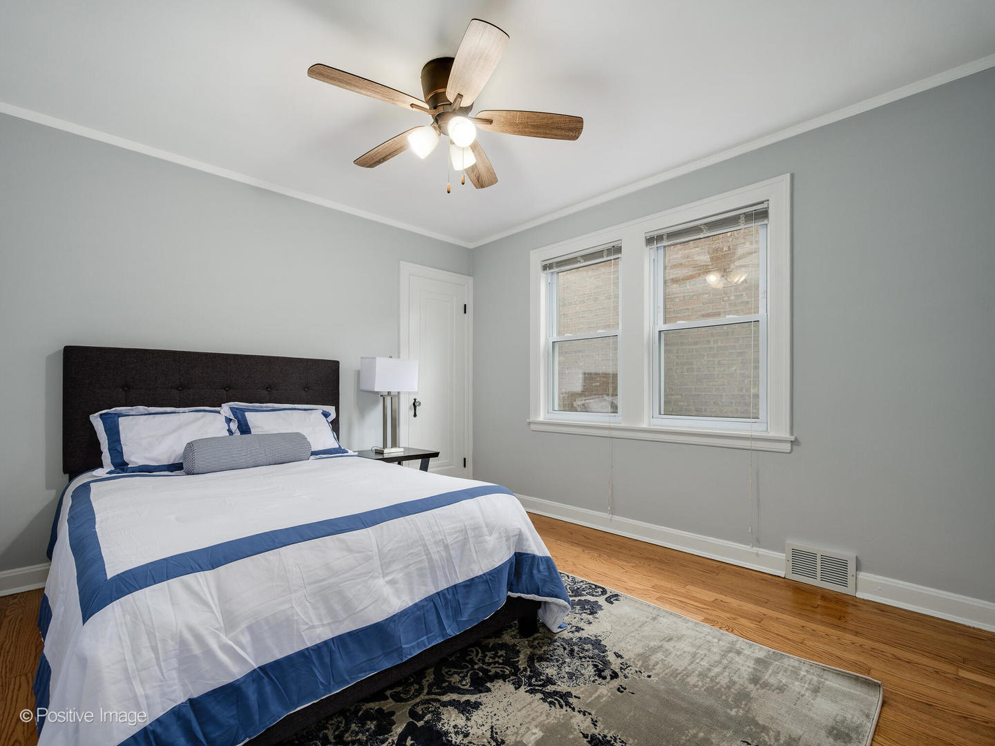 6057 West Melrose Street Chicago, IL 60634 - Photo 9 of 32 a bedroom with a large bed and a window