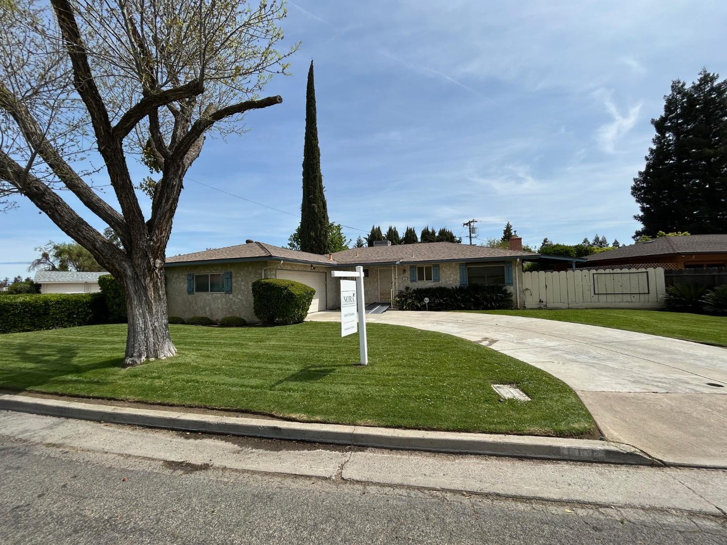 117 Berry Drive Madera, CA 93637 - Photo 1 of 16 a house with swimming pool in front of it