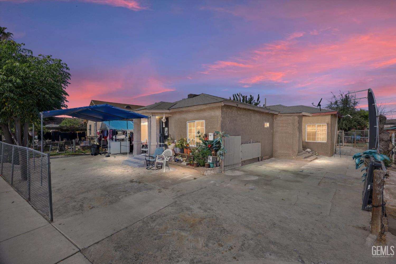 Undisclosed Address Delano, CA 93215 - Photo 1 of 43 a view of a house with backyard and porch