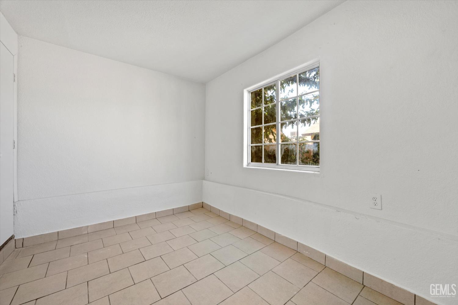 Undisclosed Address Delano, CA 93215 - Photo 13 of 43 a view of an empty room with a window
