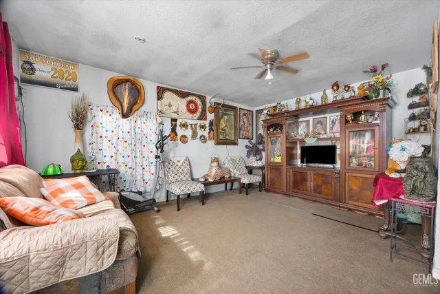 a bedroom with furniture and a flat screen tv