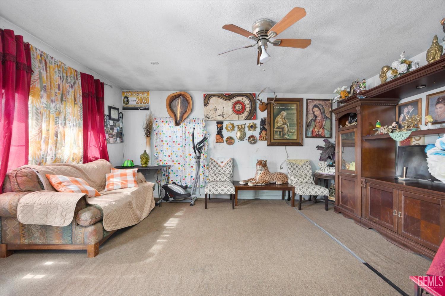 Undisclosed Address Delano, CA 93215 - Photo 16 of 43 a living room with furniture and a flat screen tv