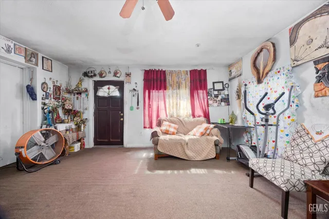 a living room with furniture and gym equipment