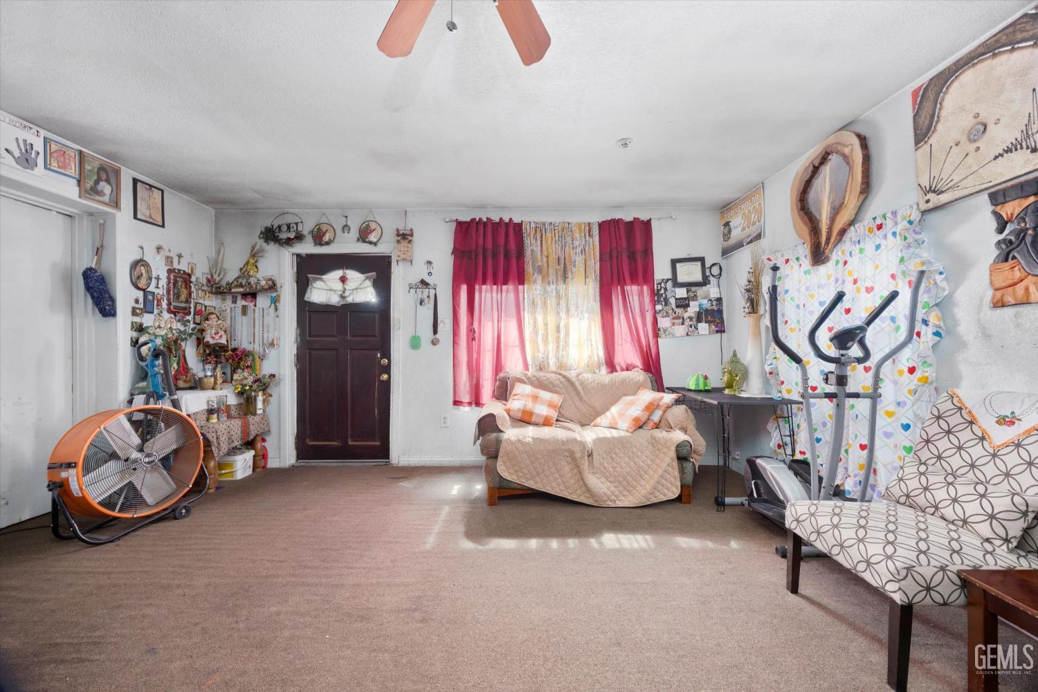 Undisclosed Address Delano, CA 93215 - Photo 18 of 43 a living room with furniture and gym equipment