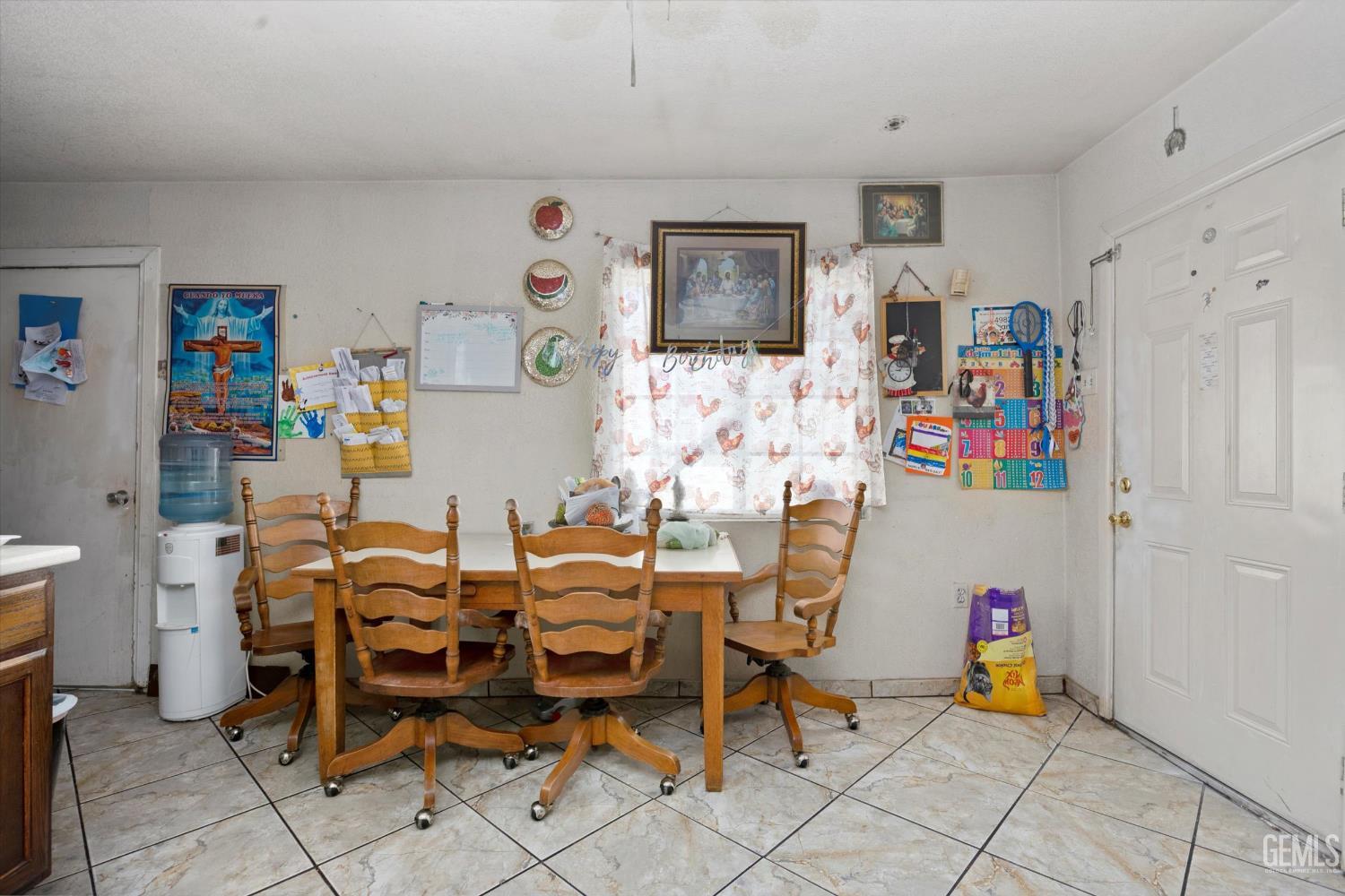 Undisclosed Address Delano, CA 93215 - Photo 19 of 43 a room with furniture a rug and a window
