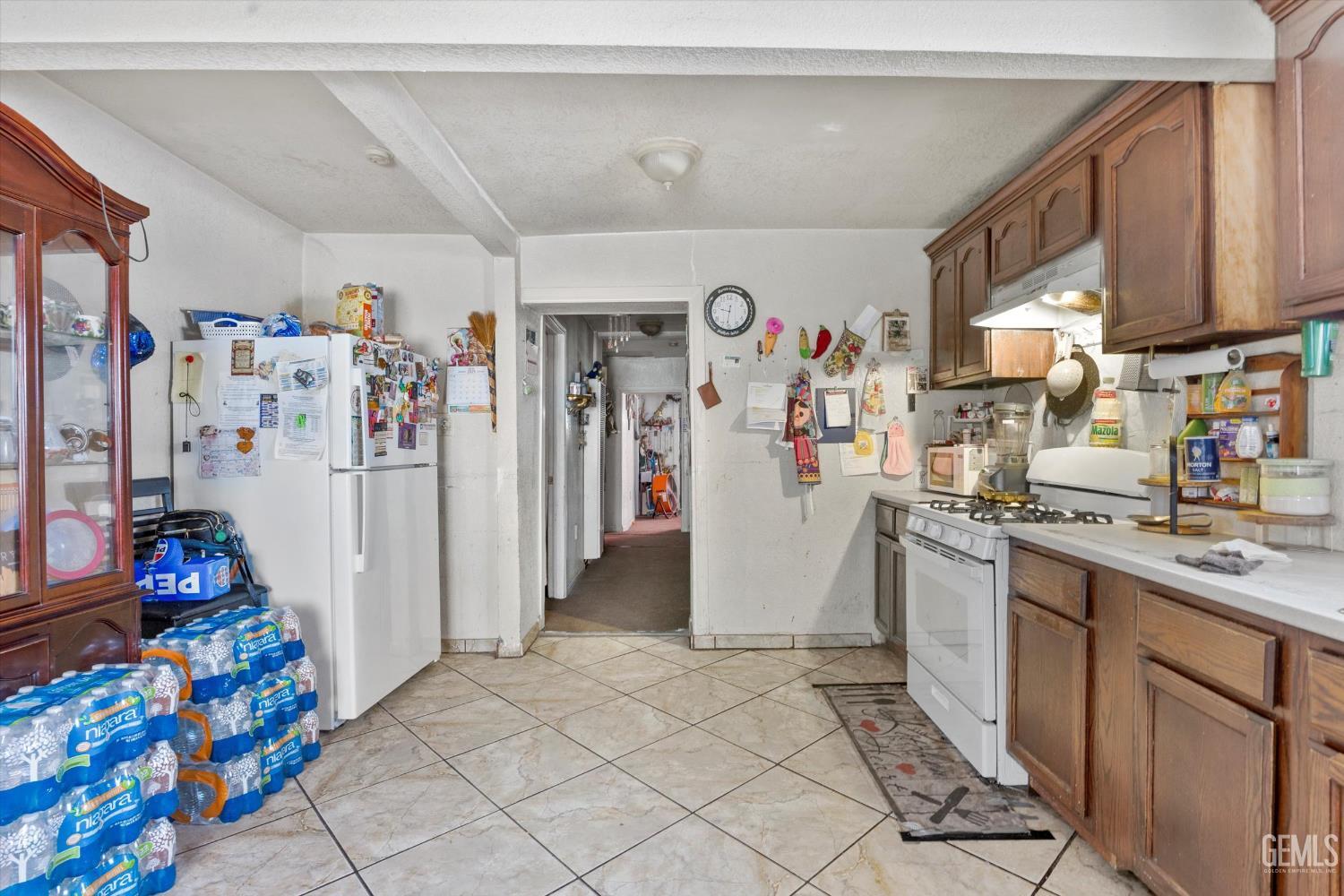 Undisclosed Address Delano, CA 93215 - Photo 21 of 43 a view of a kitchen with fridge and workspace