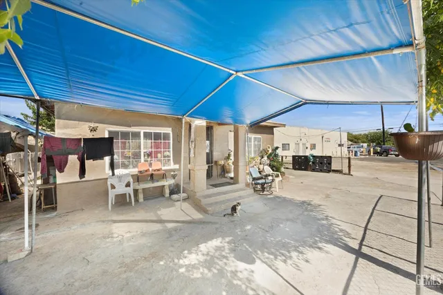 a view of a backyard with sitting area