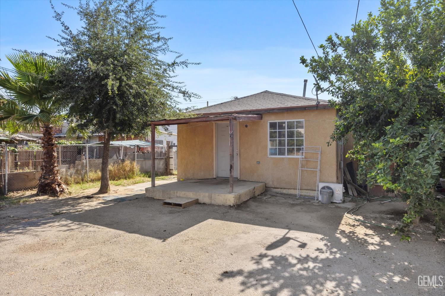 Undisclosed Address Delano, CA 93215 - Photo 3 of 43 a backyard of a house with a tree