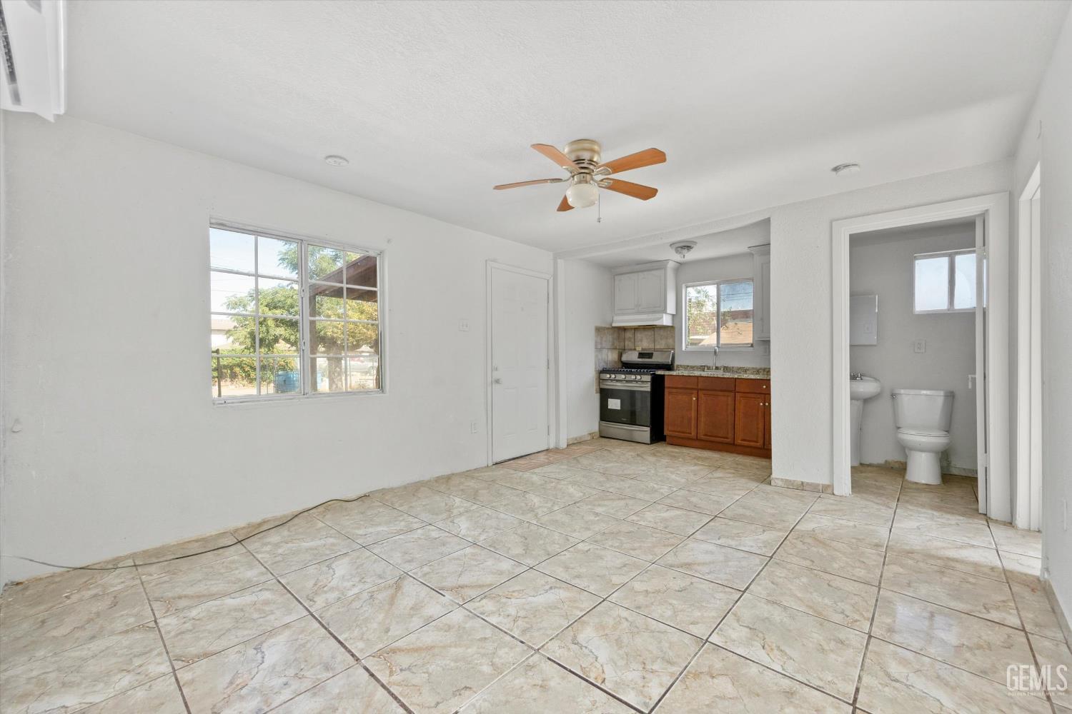 Undisclosed Address Delano, CA 93215 - Photo 4 of 43 a view of a kitchen with furniture and windows