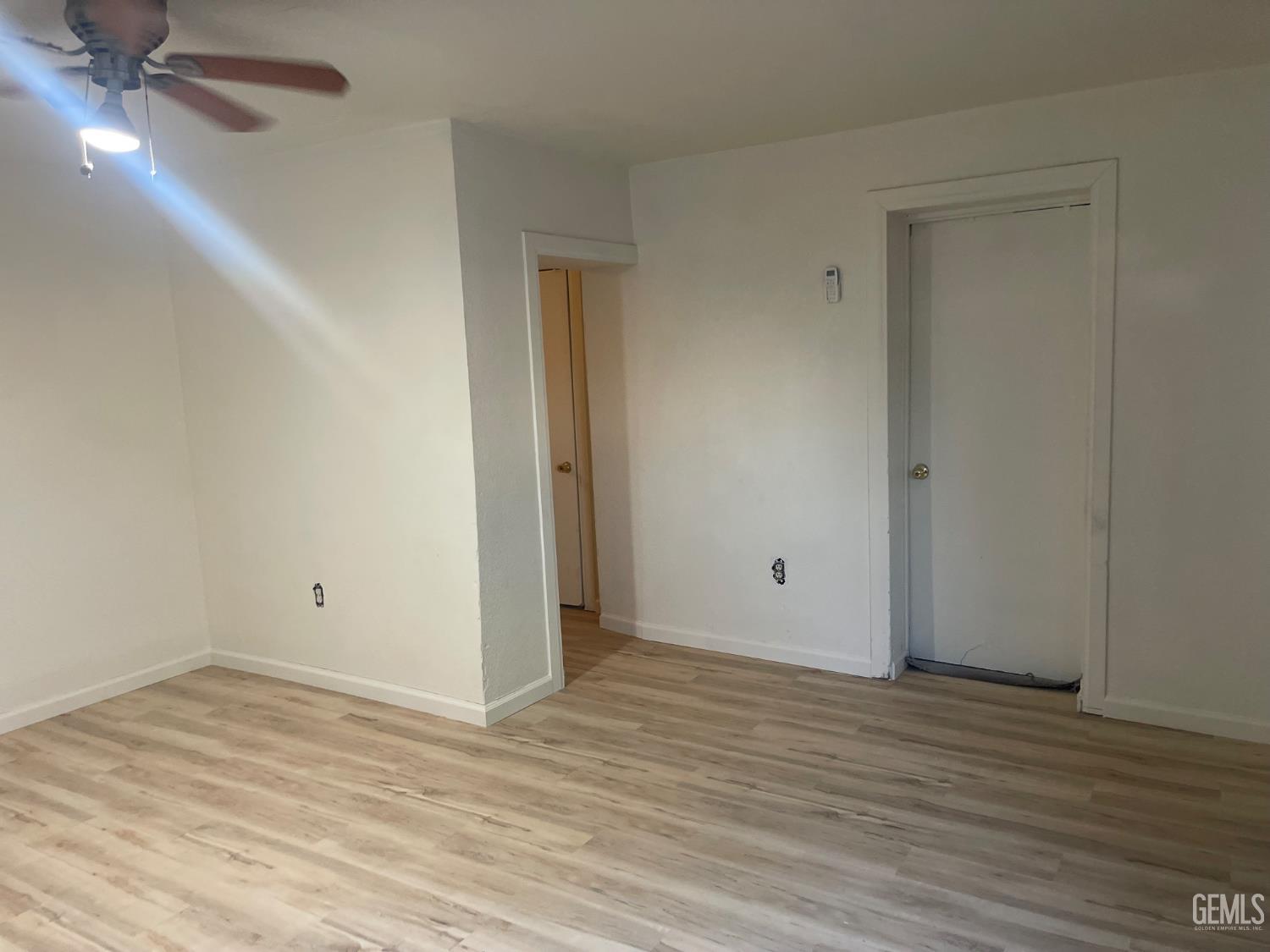 Undisclosed Address Delano, CA 93215 - Photo 43 of 43 a view of an empty room with wooden floor