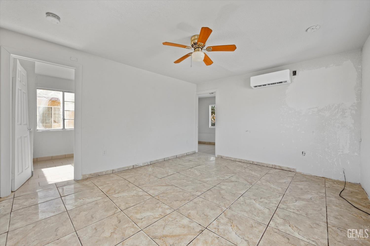 Undisclosed Address Delano, CA 93215 - Photo 6 of 43 a view of a livingroom with a ceiling fan and window