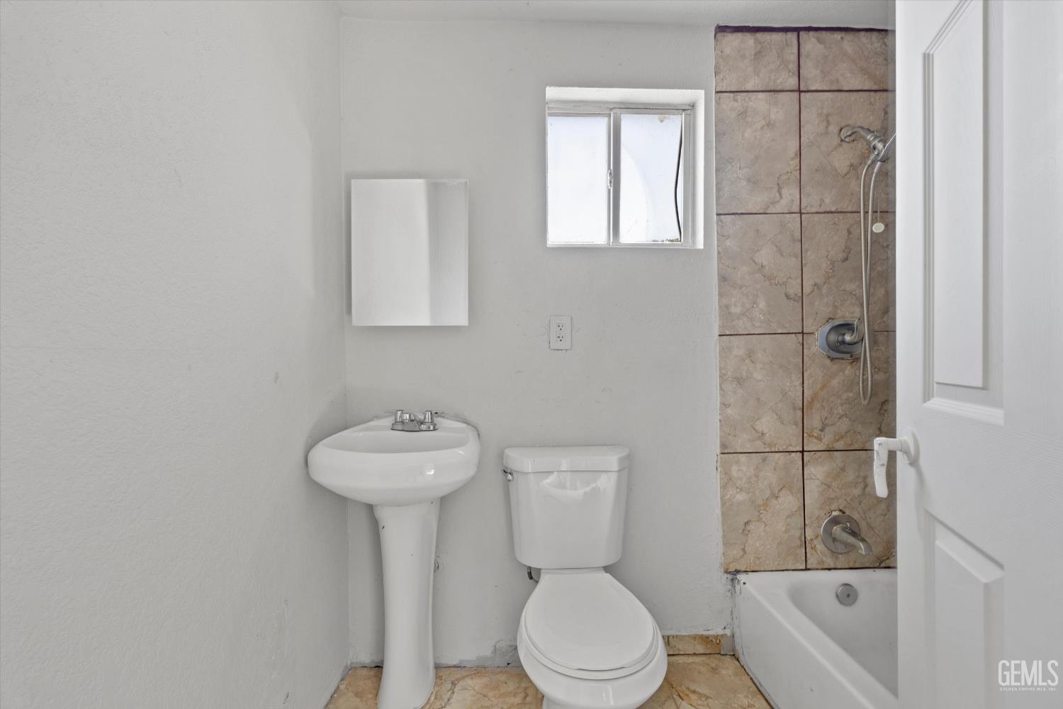 Undisclosed Address Delano, CA 93215 - Photo 10 of 43 a bathroom with a sink toilet and shower
