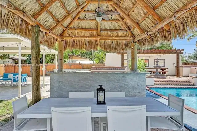 a kitchen with a table and chairs in it